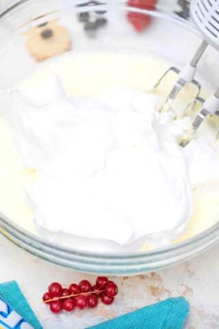 folding whipped cream into cream cheese mixture