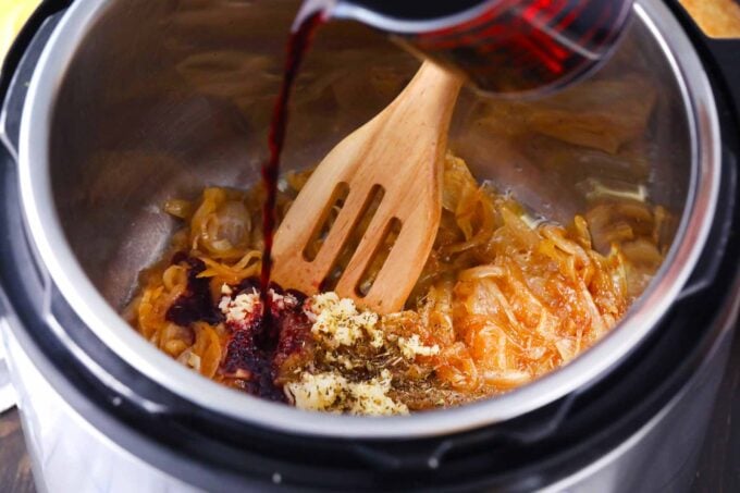 sliced onions and brown sugar, spices, and red wine in the instant pot