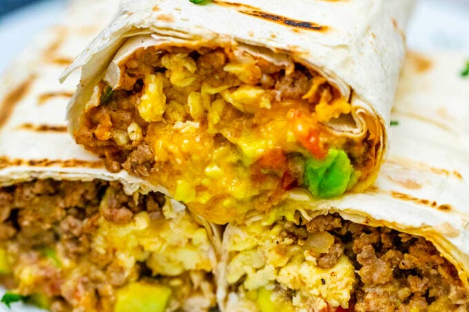 Very cheesy Mexican taco burrito with ground beef.