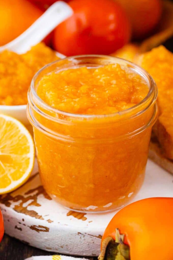 a mason jar with homemade persimmon jam