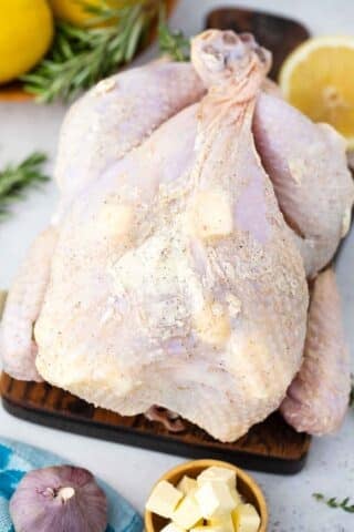 whole chicken coated in butter