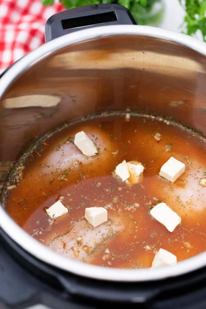 Instant pot shredded chicken ingredients in the pot.