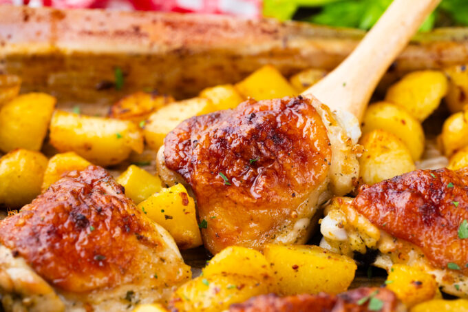 A sheet pan of perfectly roasted chicken and potatoes.