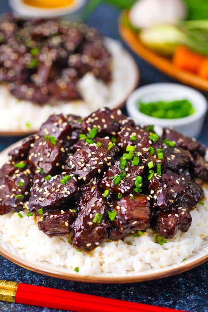 sticky honey garlic beef on top of white rice