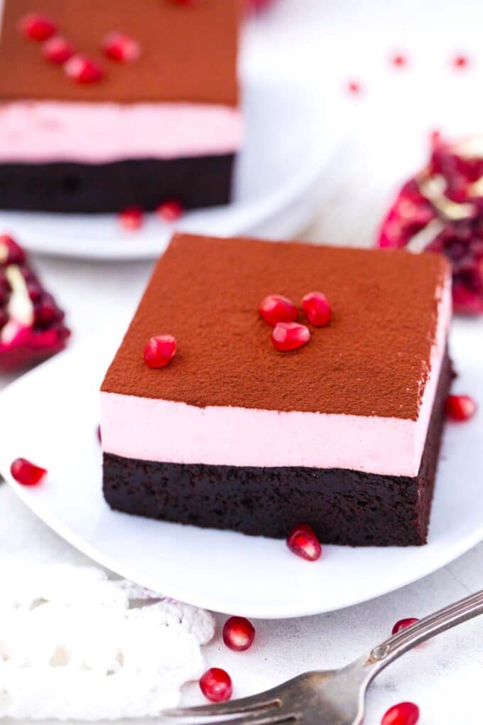 pomegranate mousse brownies on a plate