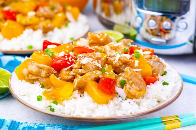 A plate of slow cooker Hawaiian chicken over rice.