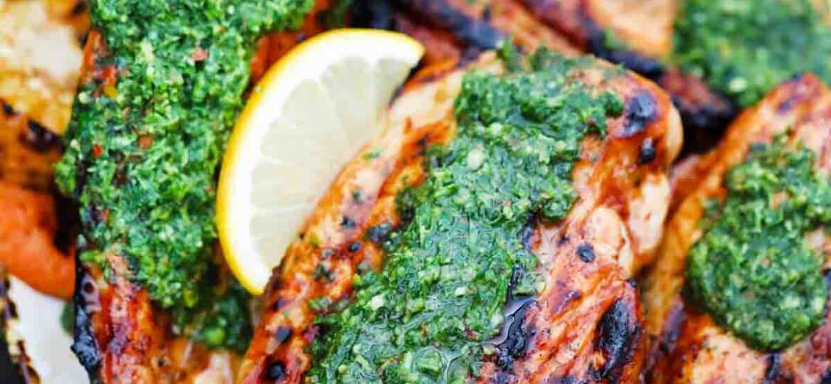 overhead shot of grilled chimichurri chicken served with corn