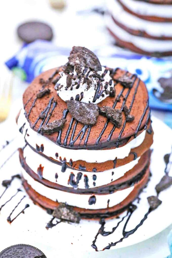 stacked oreo pancakes with chocolate drizzle