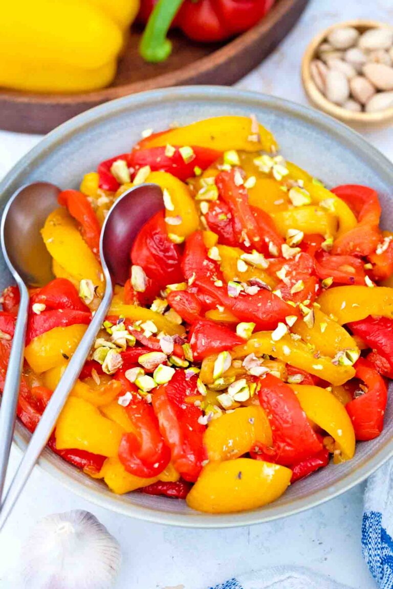 overhead shot of homemade roasted bell peppers with chopped pistachios