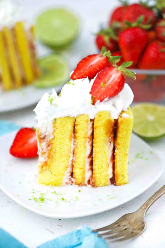 a slice of strawberry lime cake with vertical layers