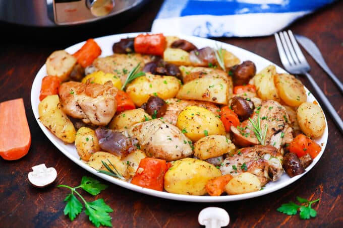 A serving plate of instant pot chicken and vegetables.