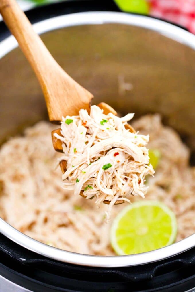 A serving spoon of instant pot shredded chicken.