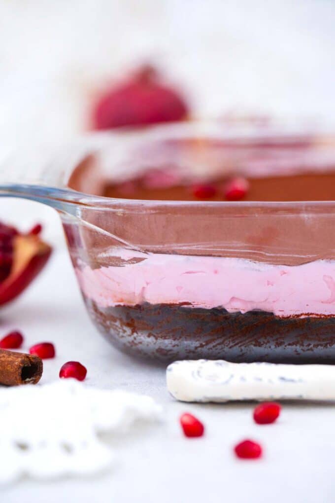 a pan of layered pomegranate mousse brownies