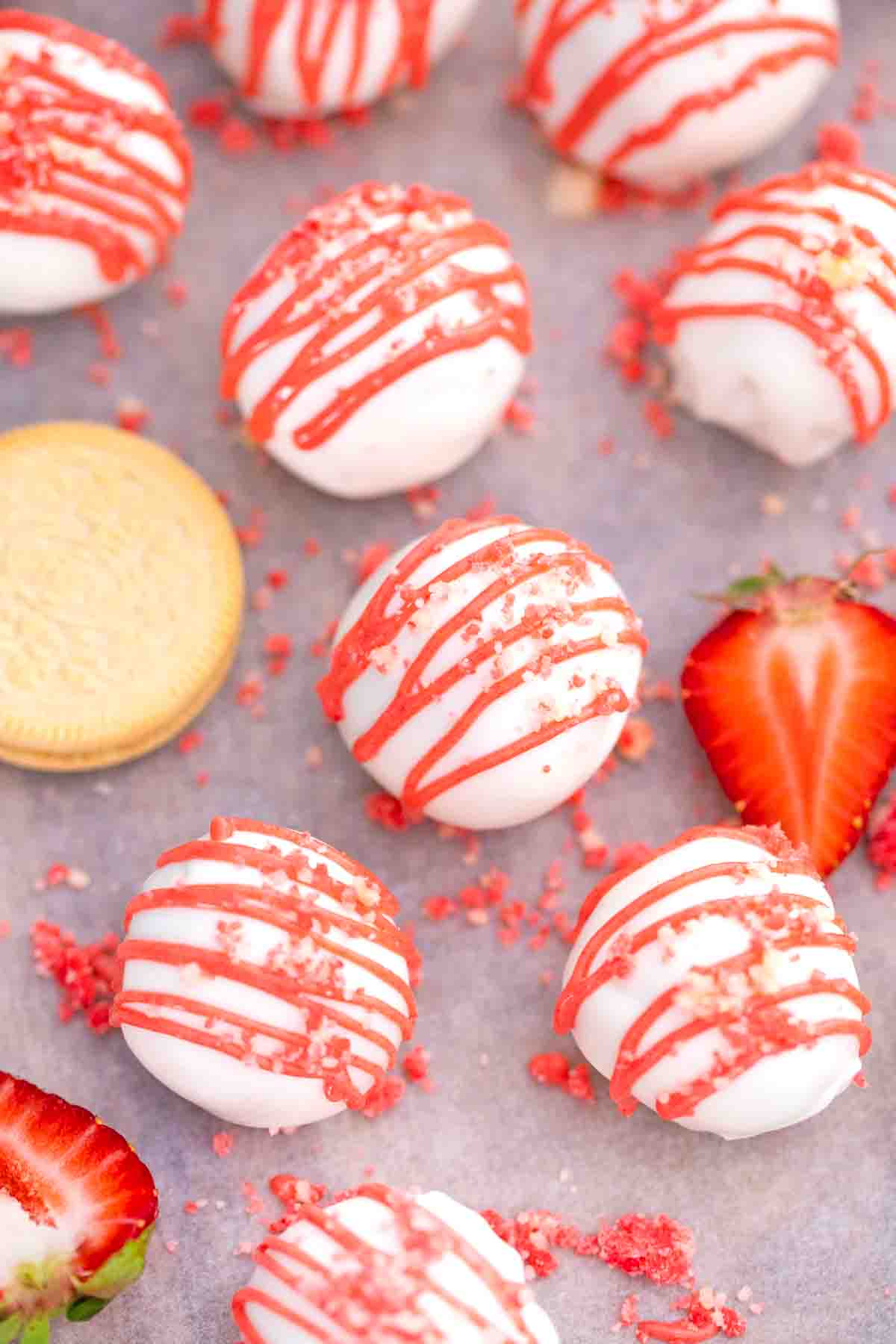 strawberry shortcake truffles on a baking sheet