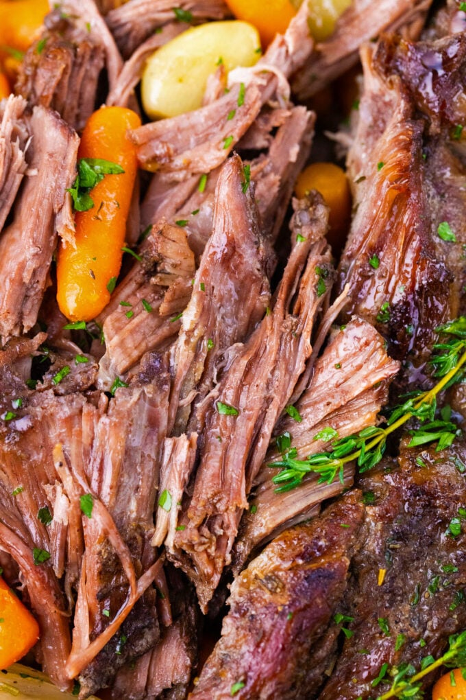 Very tender red wine slow cooker pot roast.