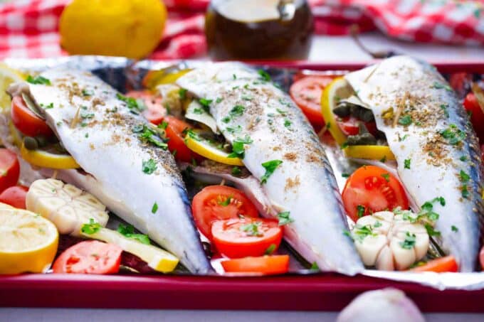 stuffed Spanish mackerel with tomatoes, lemons, garlic and herbs