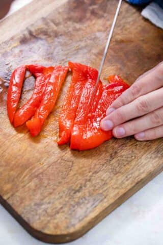 slicing a roasted pepper