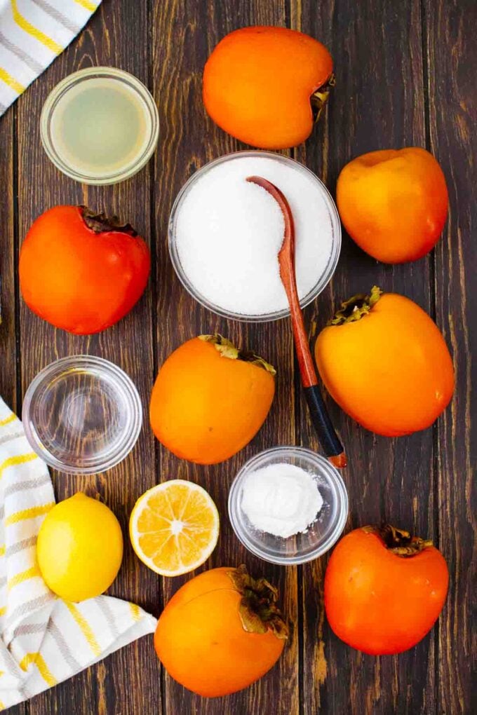 persimmon jam ingredients arranged on a wooden table