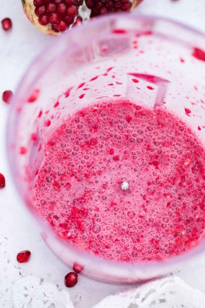 chopped pomegranate seeds in a food processor