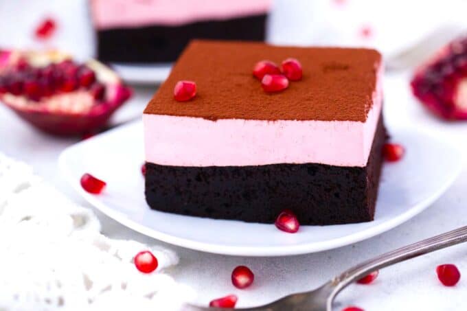 a plate with a pomegranate mousse brownies slice