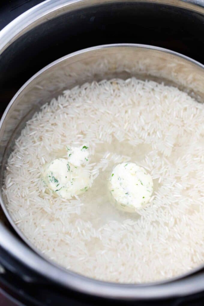 a trivet with rice water and butter in the instant pot