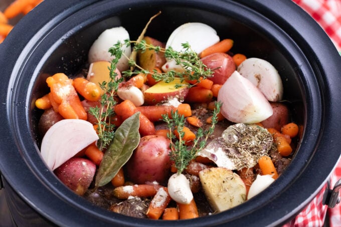 Red wine slow cooker pot roast ingredients in the crockpot.