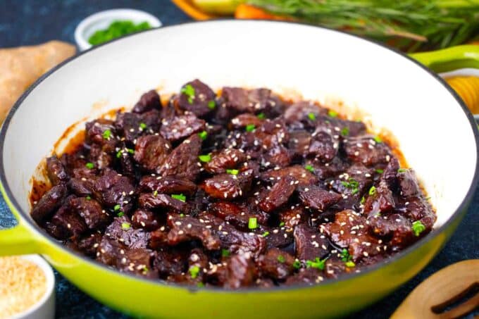 a skillet with crispy sticky honey garlic beef