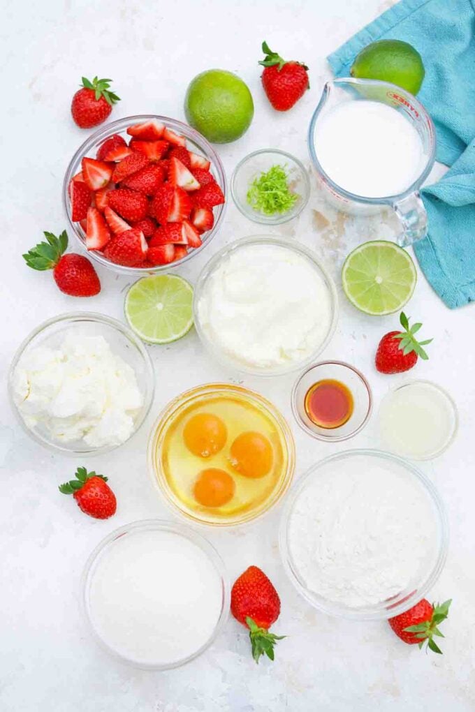 overhead shot of strawberry lime cake ingredients on a table
