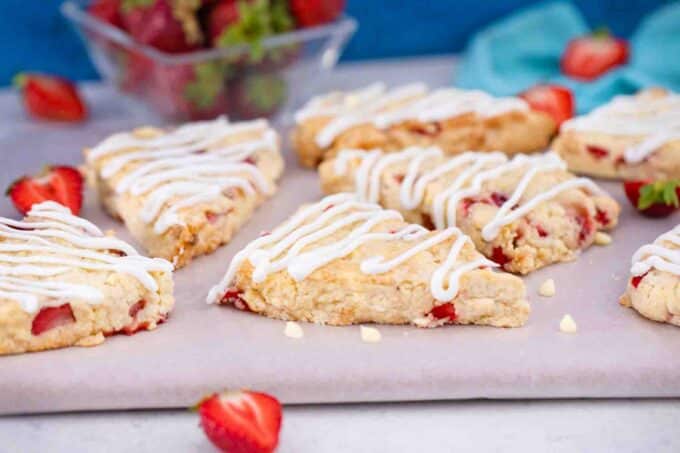 strawberry scones with fresh strawberries on a serving board