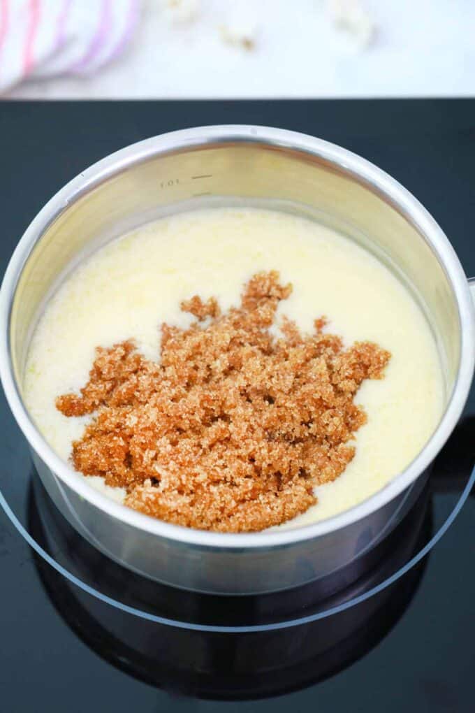 adding brown sugar to melted butter in a saucepan