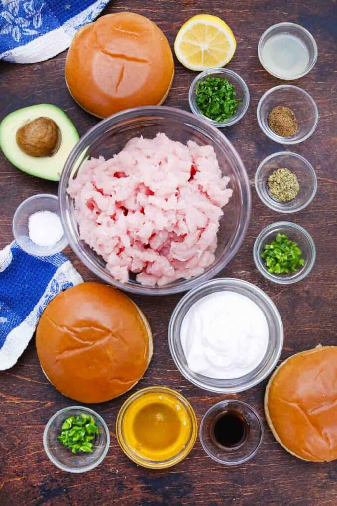 overhead shot of turkey burgers ingredients in bowls on a table