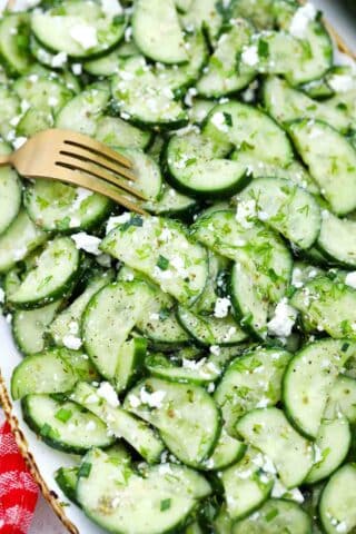 overhead shot of cucumber feta salad on a platter