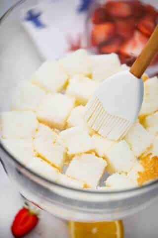 soaking angel food cake cubes in syrup