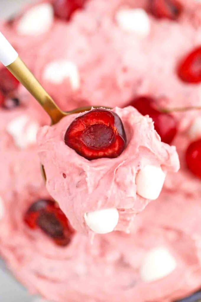macro shot of a spoonful of cherry cheesecake fluff