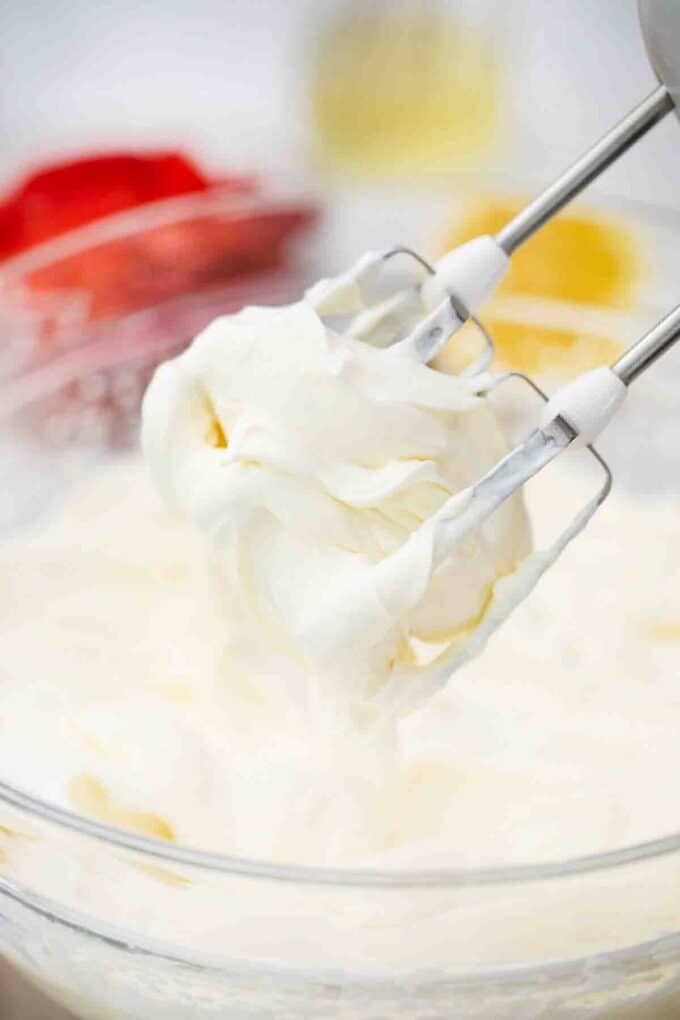 whisking lemon frosting