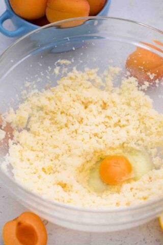 beating eggs into butter mixture
