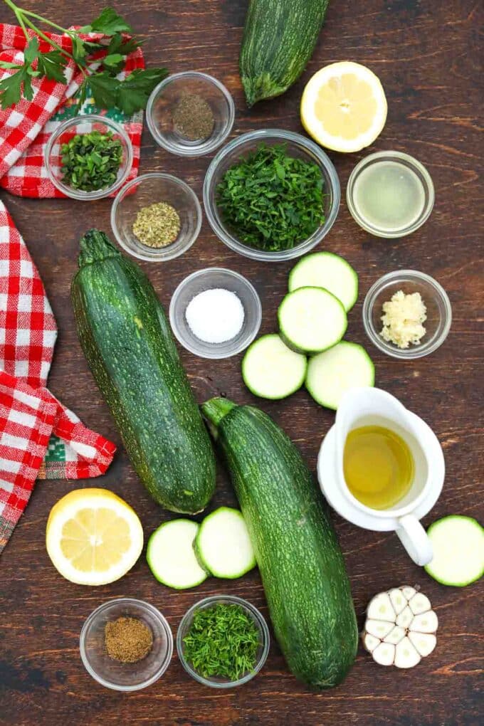 overhead shot of grilled zucchini salad ingredients on a table