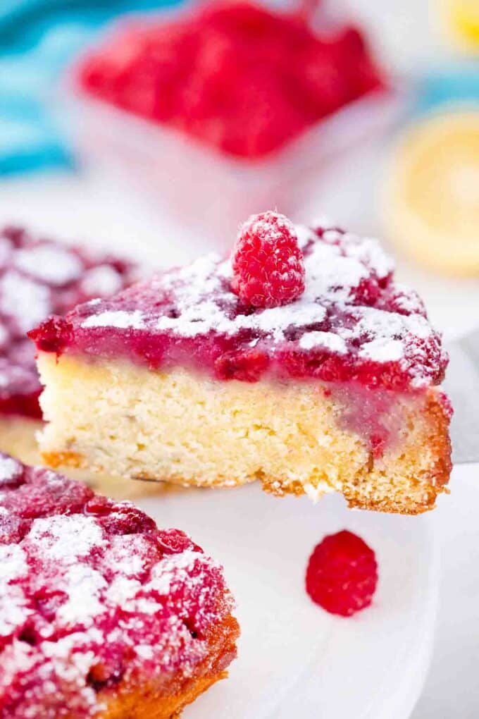 serving a slice of raspberry upside down cake