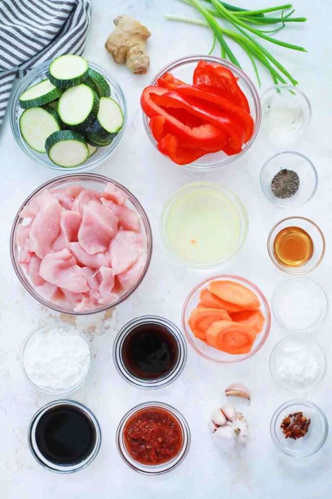 hunan chicken ingredients in bowls on a table