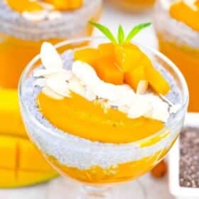 a bowl of mango chia pudding topped with mango and slivered almonds