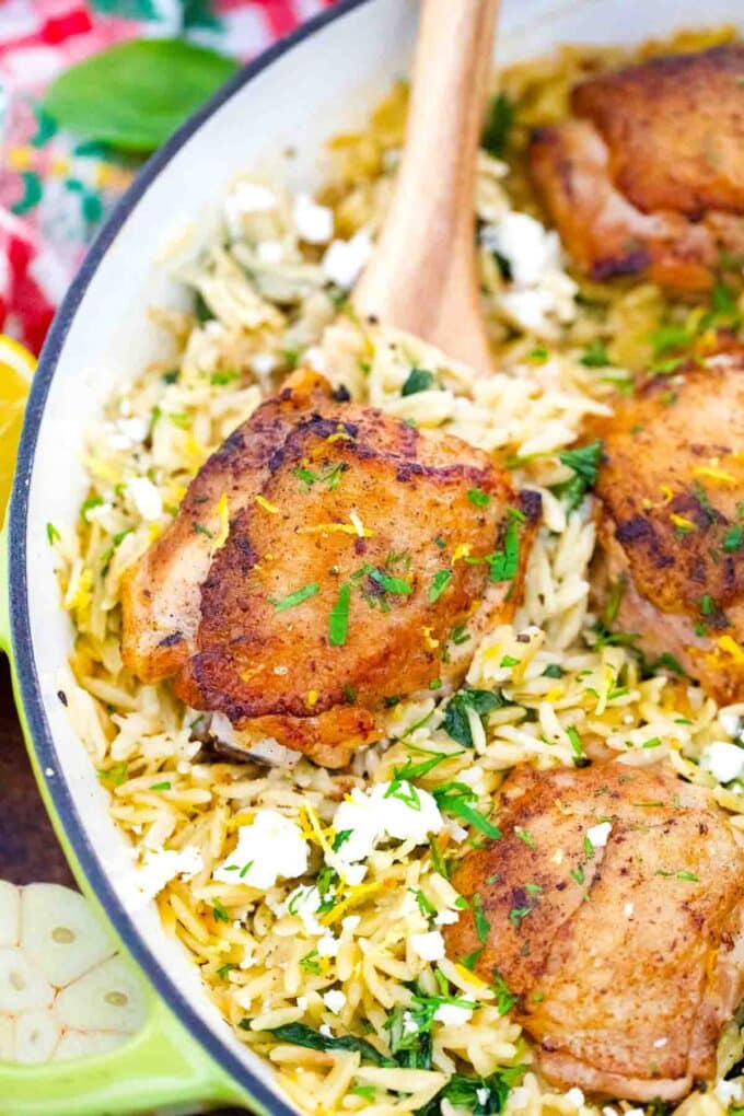 overhead shot of one pan chicken and orzo in a cast iron pan