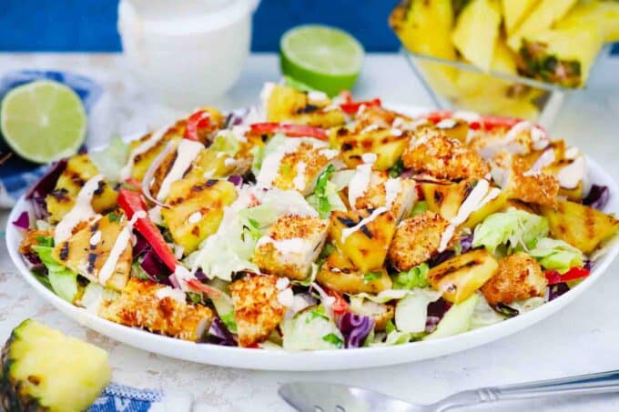 grilled pina colada chicken salad on a serving plate