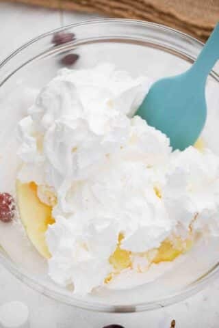 folding whipped cream into pudding