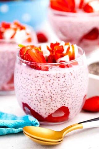 decorated glasses with fresh strawberries and with strawberry chia pudding