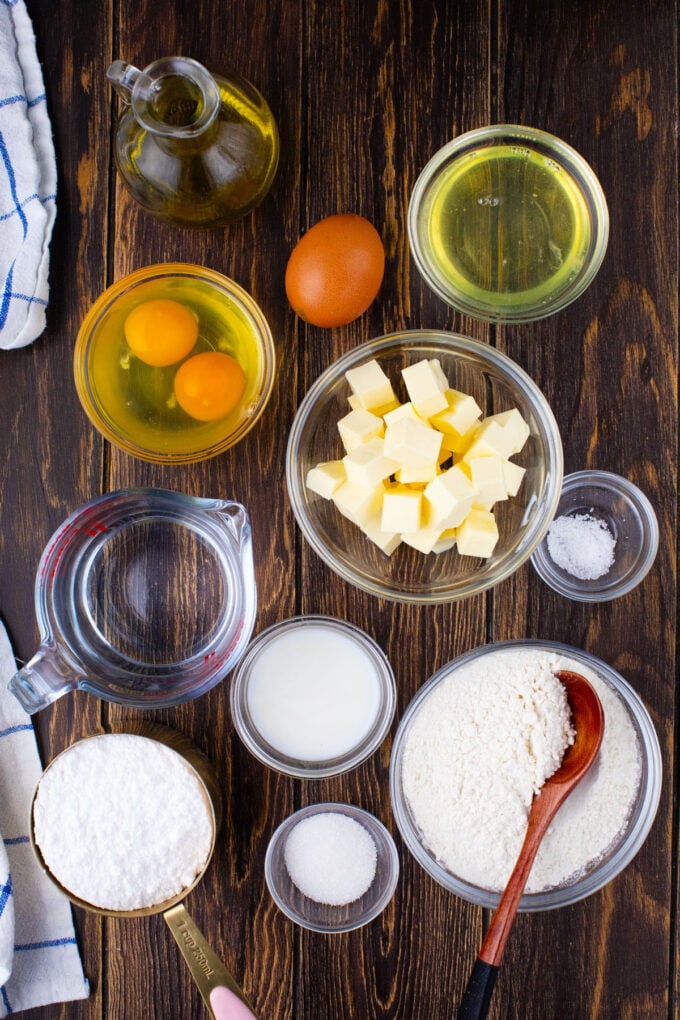 Overhead shot of Dunkin Donuts French cruller copycat recipe ingredients on a wooden surface.