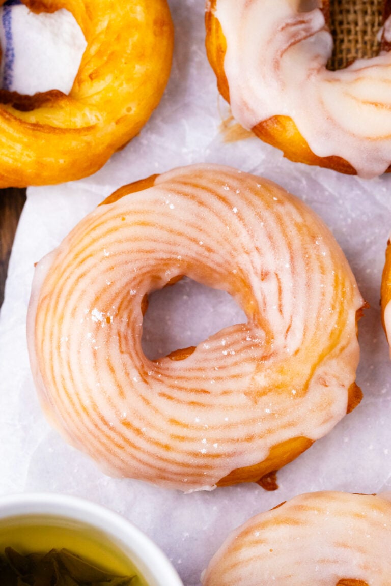 Overhead shot of homemade glazed Dunkin Donuts French cruller.