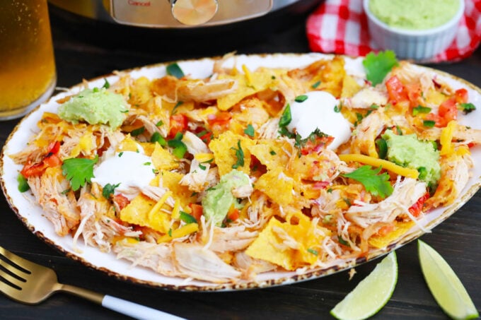 Instant Pot chicken nachos with toppings.