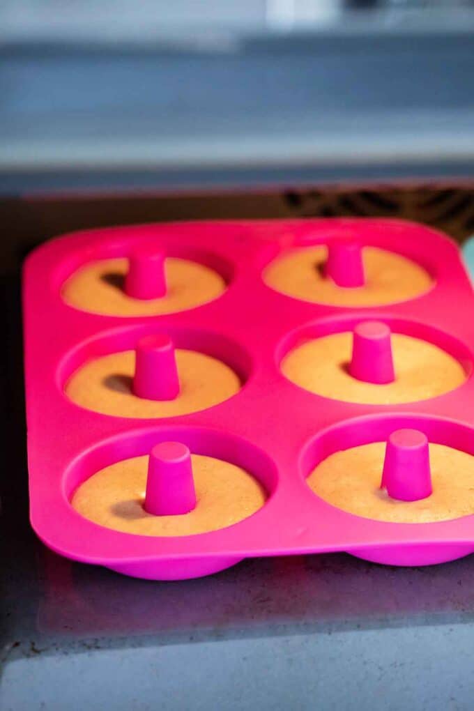 baking apple cider donuts in a silicone pan