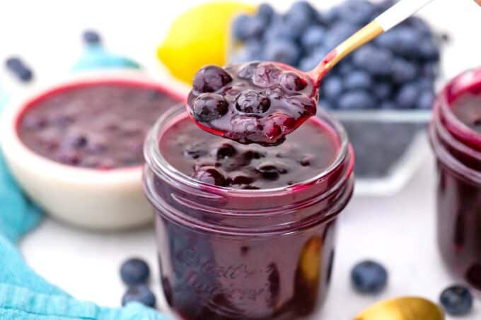 a spoonful of blueberry pie filling from a mason jar
