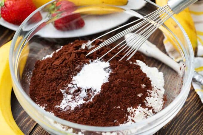 Flour, baking powder, and cocoa powder in a bowl.